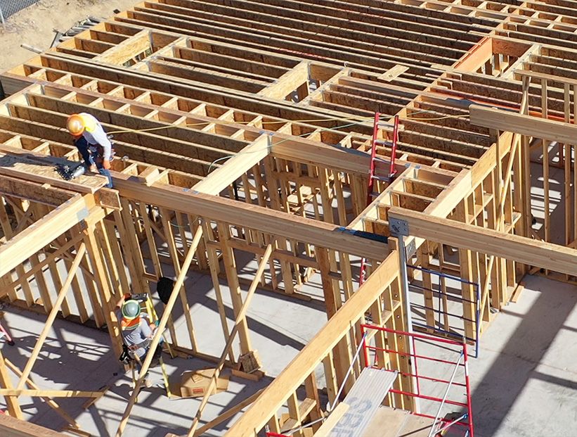 Construction workers framing a custom luxury home, Gordon Gibson Construction on-site supervision